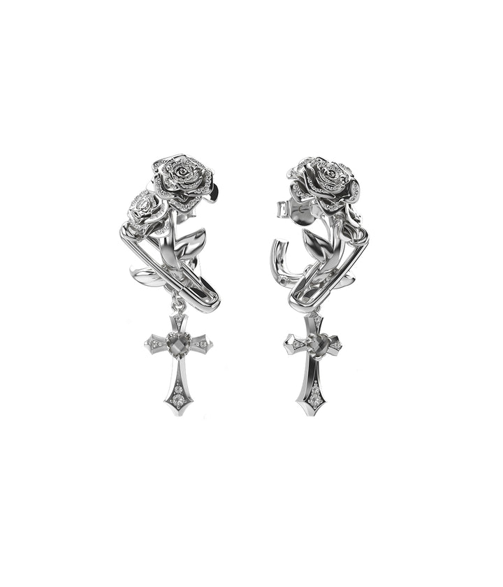 Sterling silver statement earrings with sculpted roses and crystal cross charms.