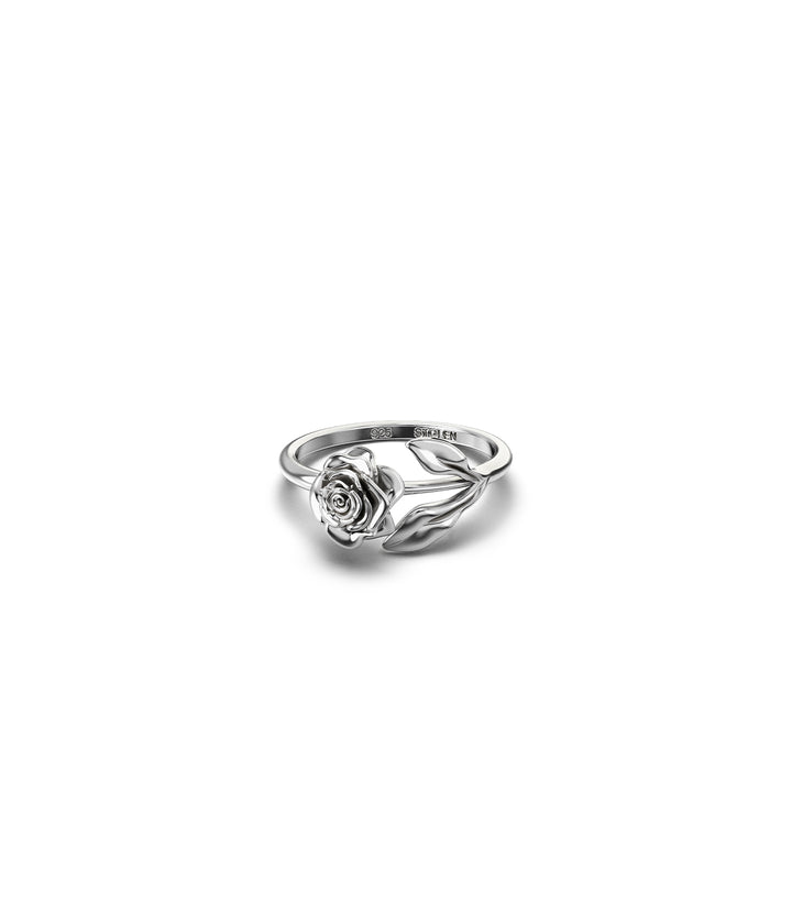 Stem Rose Ring in sterling silver, shown front-facing on white background, featuring sculpted rose bloom with curved stem and leaf detail - Stolen Girlfriends Club 