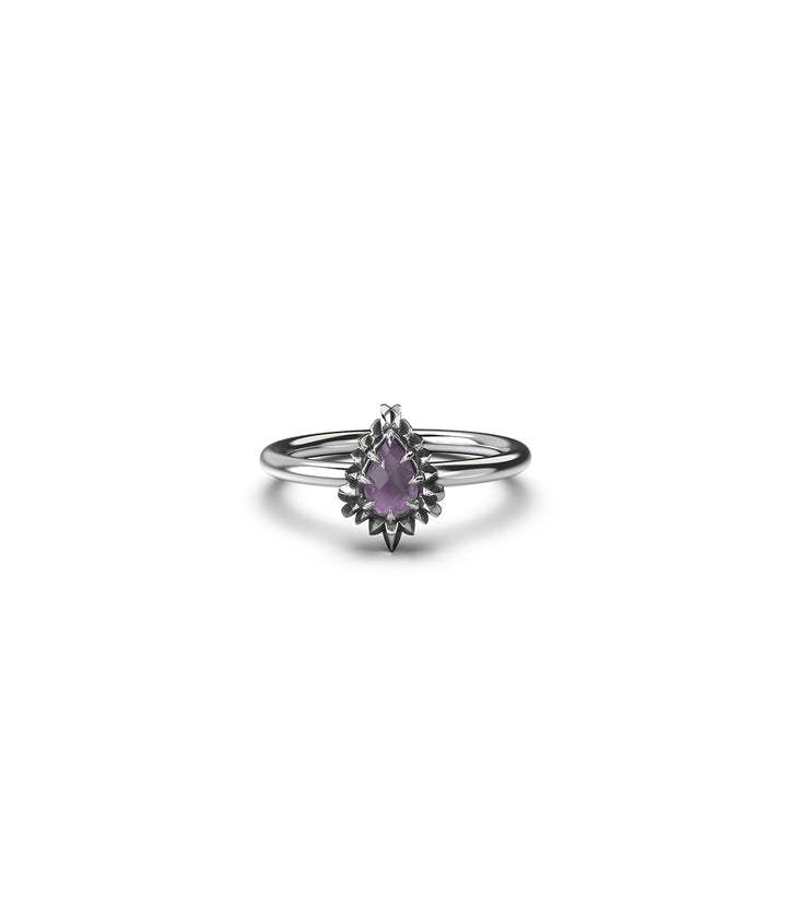 Front-facing view of sterling silver jagged teardrop ring with pink amethyst on white background.