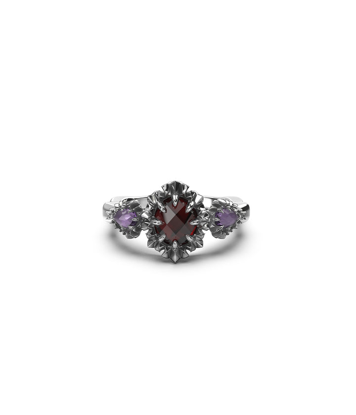 Front view of sterling silver triple gemstone ring on white background
