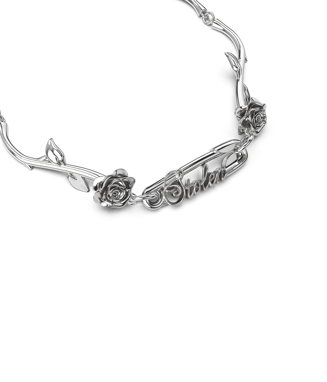 Detailed view of STOLEN safety pin and floral rose accents in polished silver.