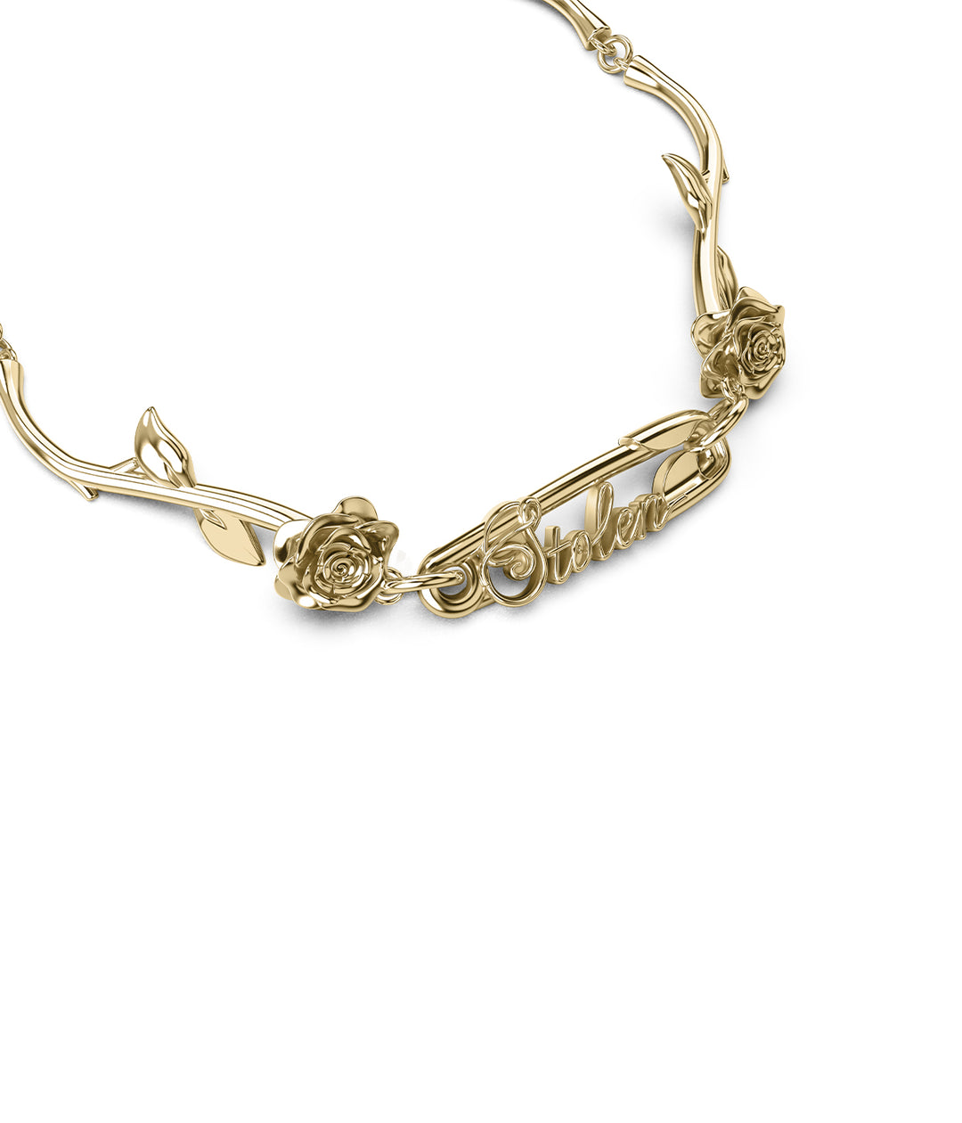 Detailed view of gold bracelet with STOLEN script on safety pin flanked by sculpted roses.