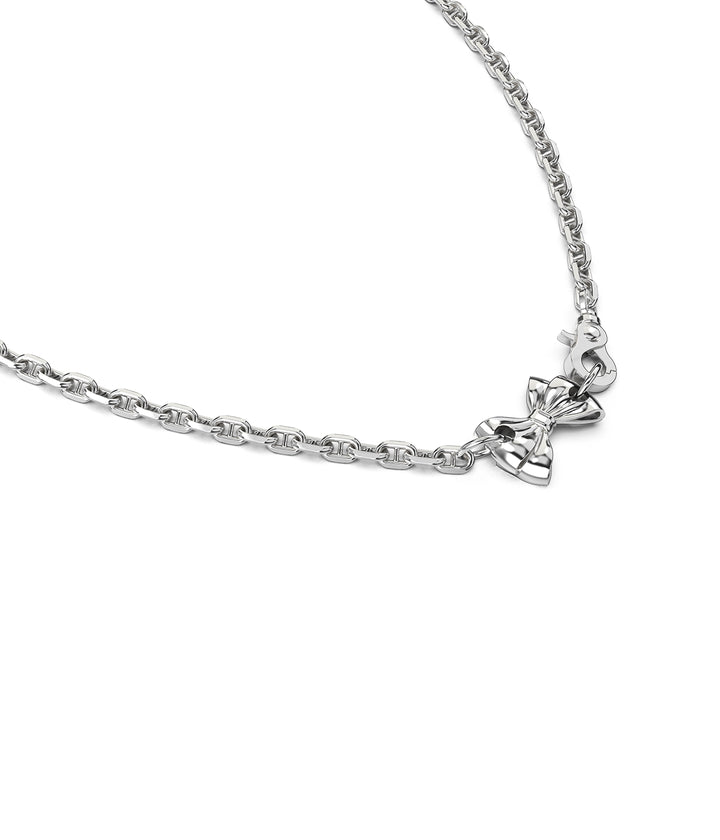 Close-up of bow charm and clasp in silver finish. Pierced Bow Necklace