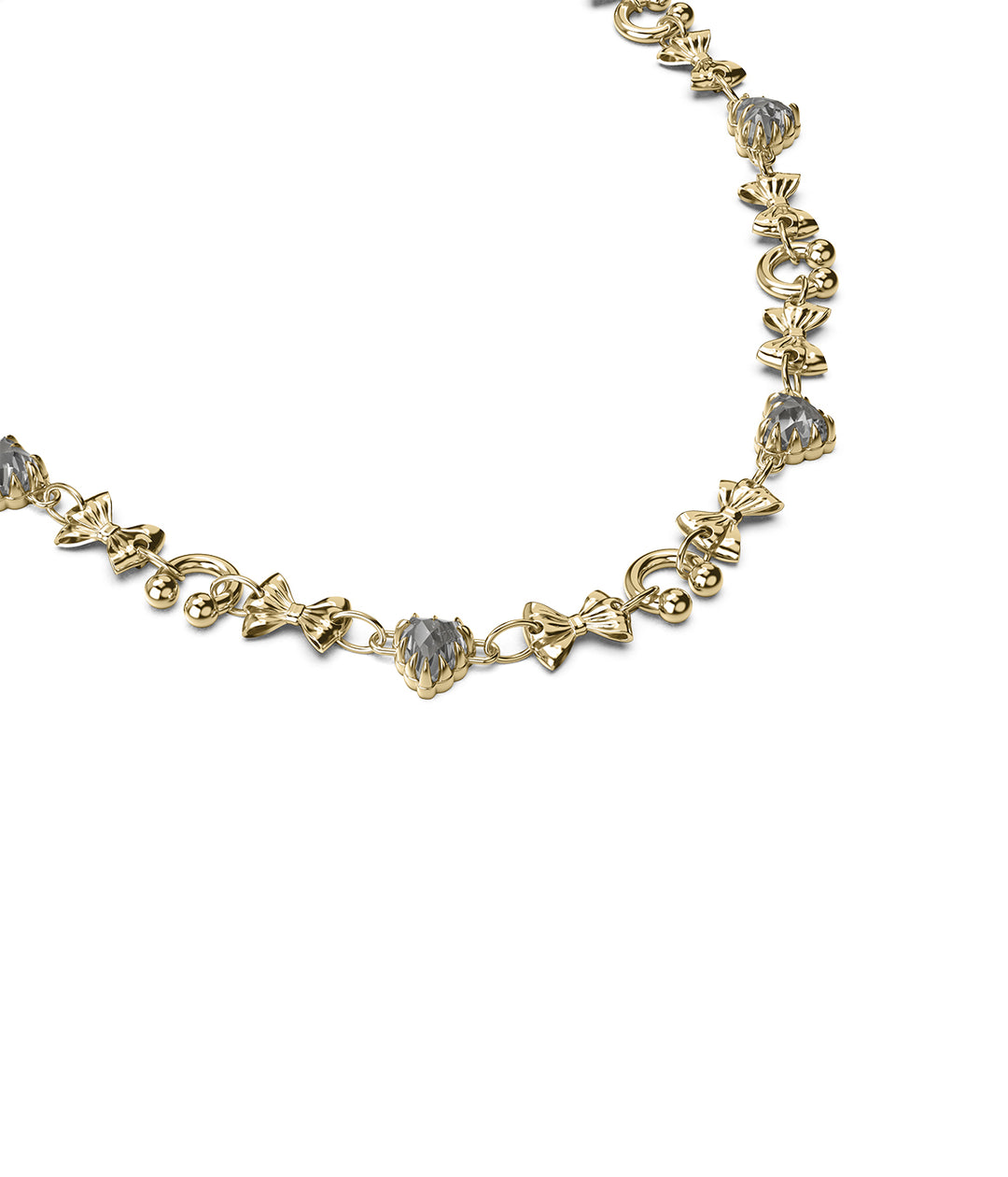 Side angle of gold charm necklace showing bows and faceted stones