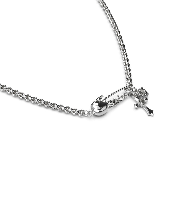 Side view of sterling silver Gothic Pin Necklace showing skull-crowned pin and finely detailed charm silhouettes.