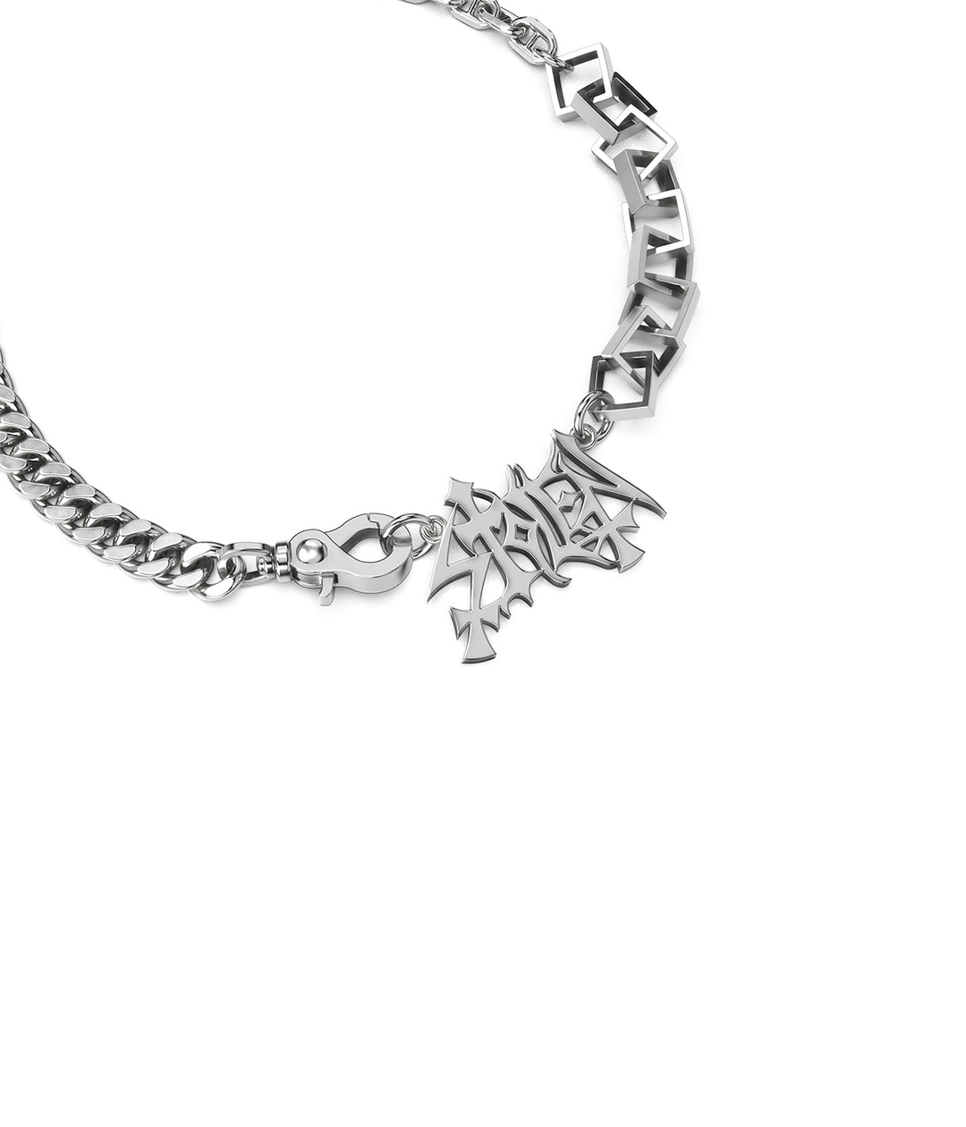 Close-up of sculptural STOLEN pendant and polished links.