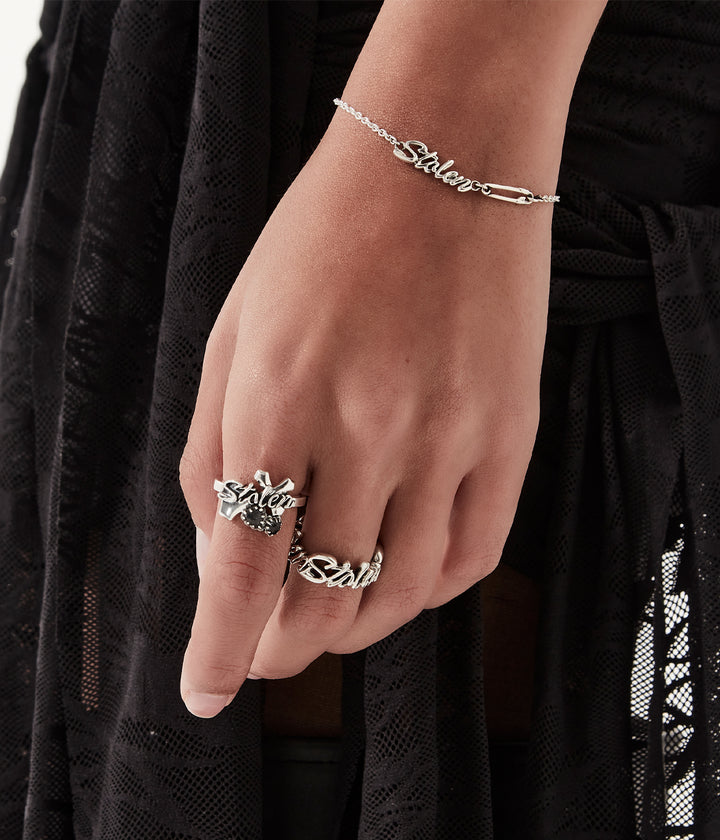 Sterling silver Gothic Sentiment Ring worn on female hand, showing proportion and styling against black outfit.