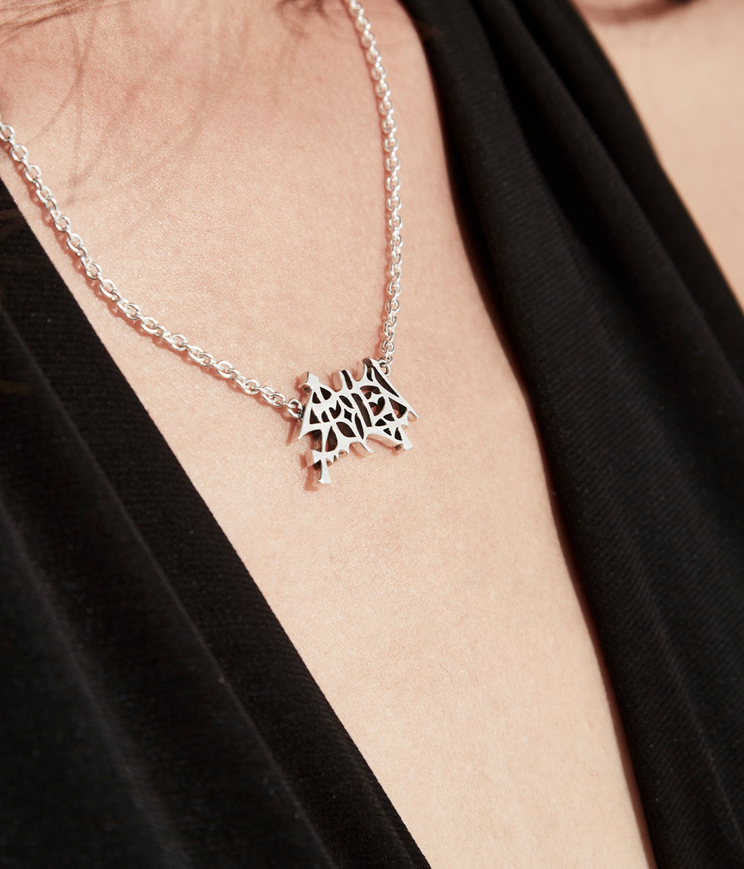 Stolen Mayhem Necklace worn on model to show length and logo scale.