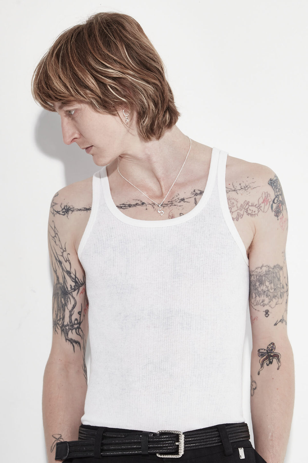 Hidden Hearts sterling silver necklace with 's' logo pendant on male model - Stolen Girlfriends Club