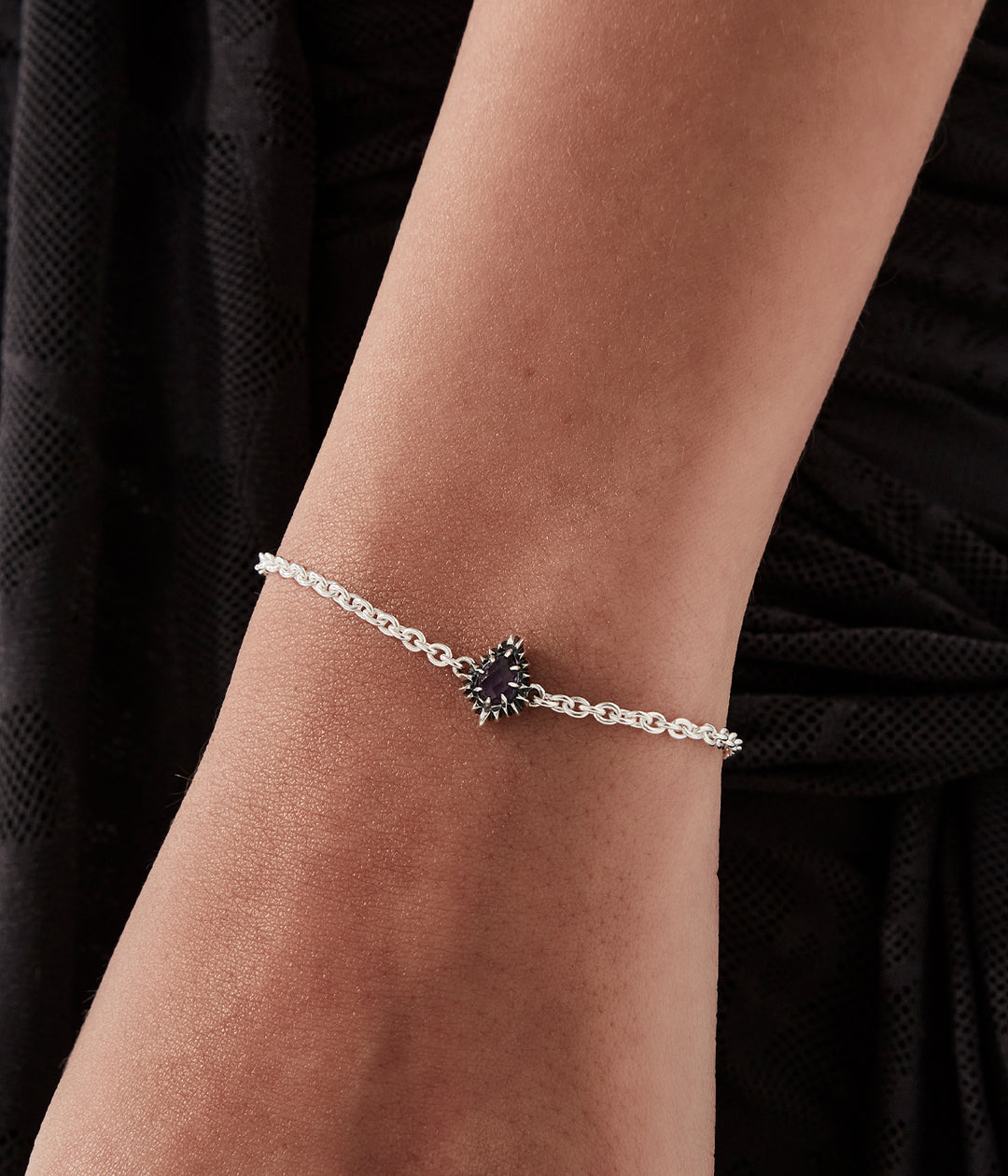 Teardrop amethyst bracelet worn by female model, illustrating proportion and shine.