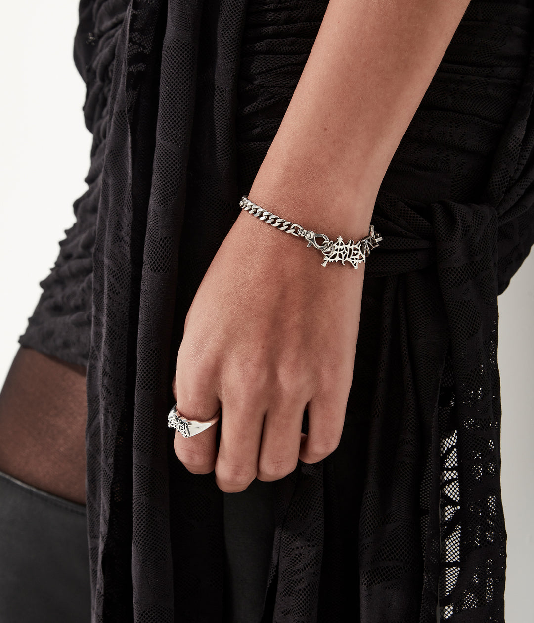 Heavy Mayhem sterling silver bracelet worn on model to show drop and scale.