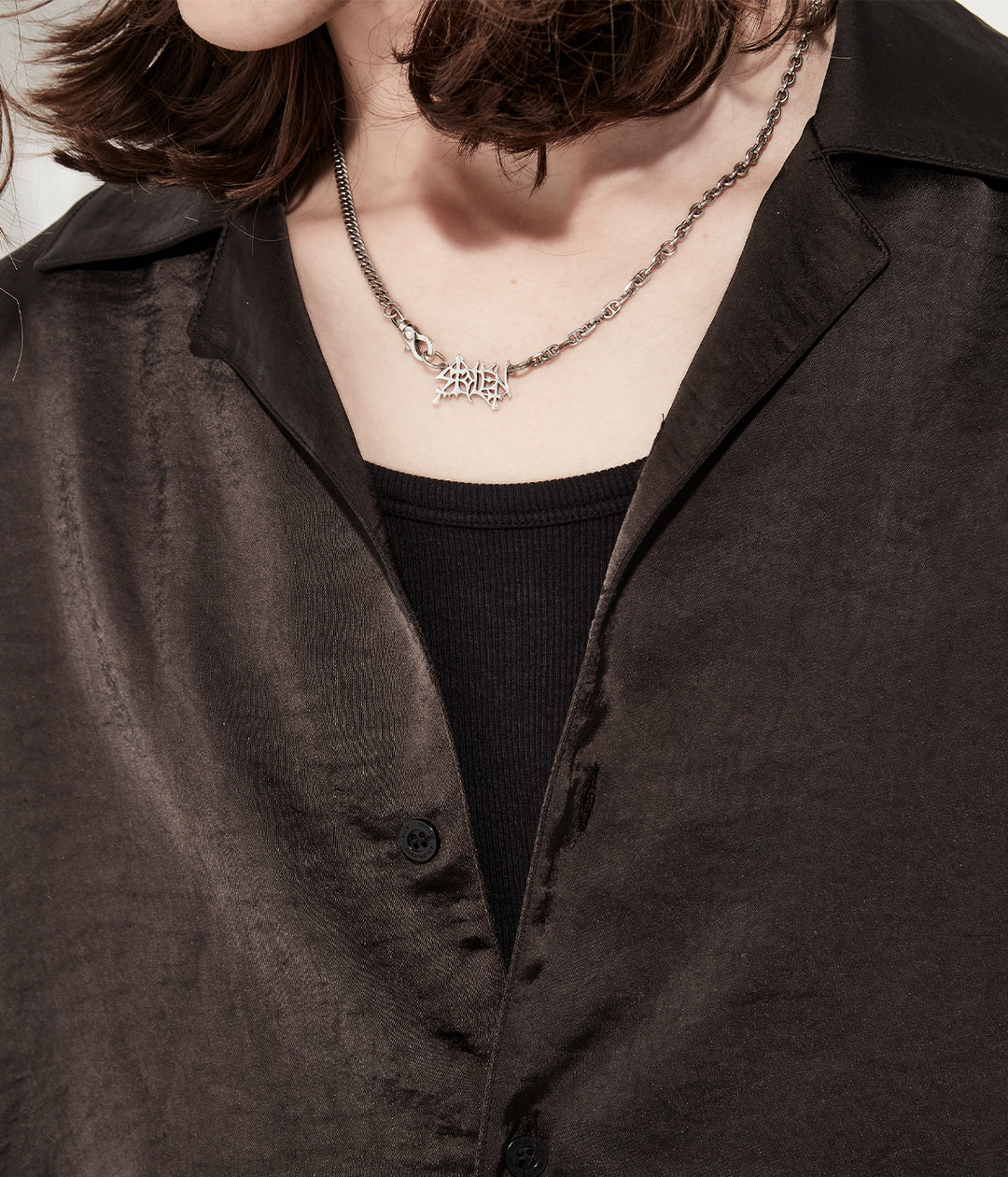 Gothic pendant necklace worn on male model to show drop and scale of 55cm chain on the neckline.