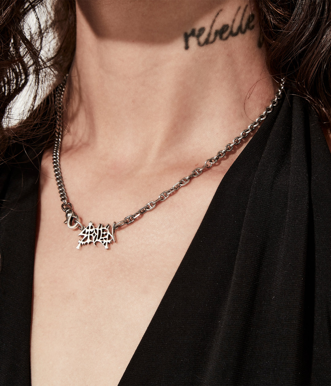 Heavy Mayhem pendant worn on female model to show drop and scale.