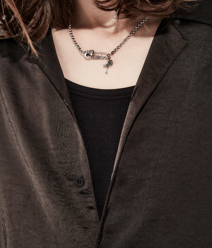 Sterling silver Gothic Pin Necklace styled on male model to show pendant scale and chain placement.