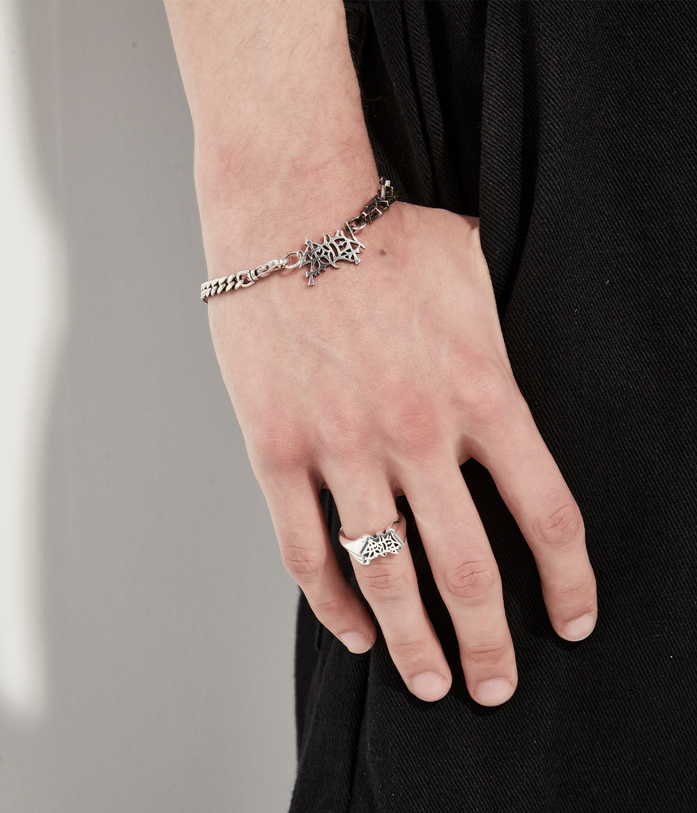 Close up of Heavy Mayhem bracelet worn on model to show drop and scale