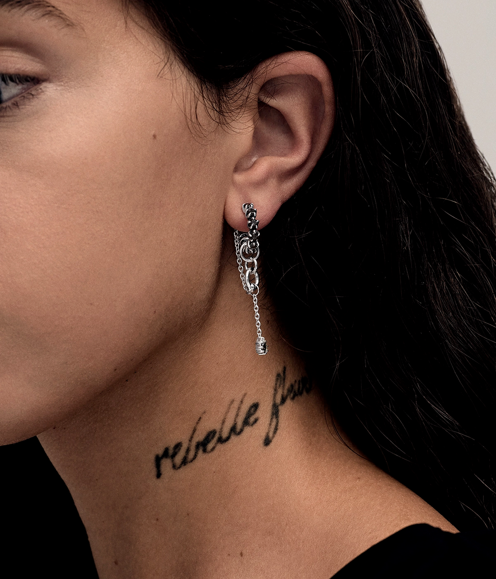 Image 3 — Model / On-Ear
Model wearing elongated Metasoma Eternity Hoops in sterling silver with faceted Clear Quartz and cascading chains that move below the ear.