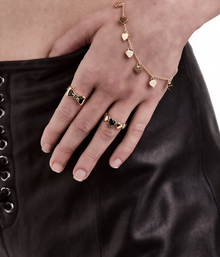 Gold-plated Bow Ring worn by female model, styled for scale and softness in natural light.