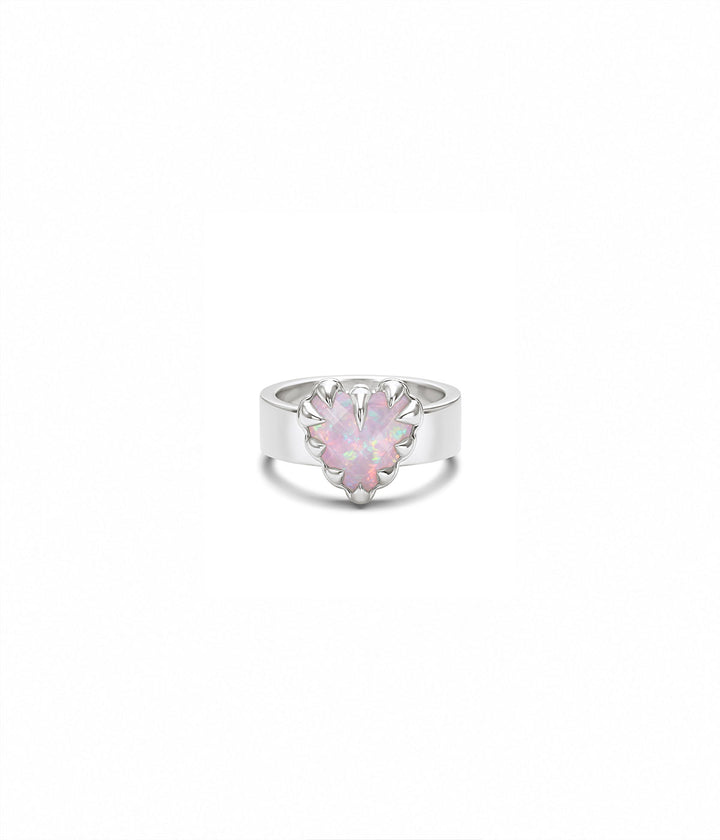 Sterling silver Love Claw Ring by Stolen Girlfriends Club with heart-shaped Pink Bello Opal held in an oversized multi-claw setting on white background. 