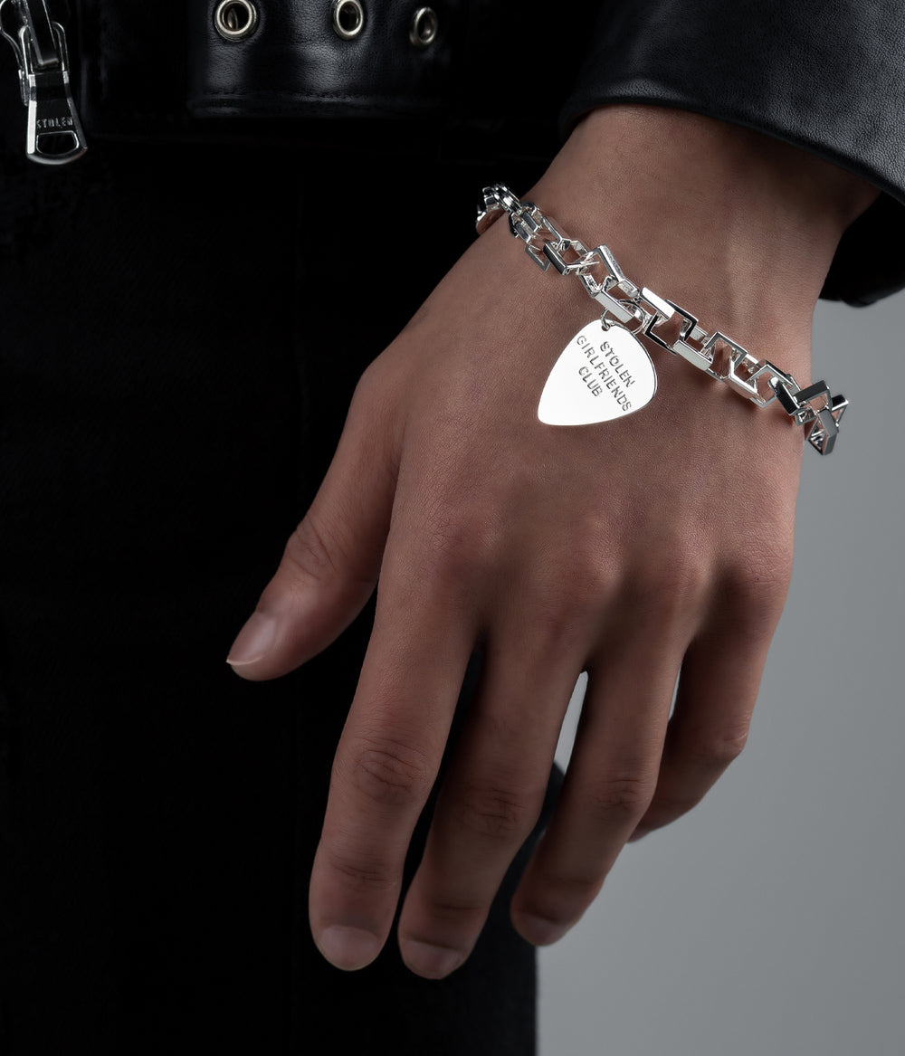 Bracelet on male model’s wrist, styled to highlight bold chain profile and polished finish.